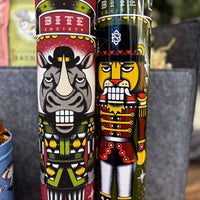 Two colorful nutcracker-themed cookie tins