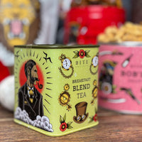 Tea canister with vintage design on a wooden surface