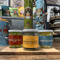 Jarred Candies: Sour Apple Dots, Chocolate Covered Almonds, Lemondrops. PS you also get Finnish Licorice which someone (me) forgot toput in the photo