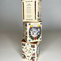 A stack of Bite Society Tulsi Spice Tea Tins showing three sides of this tattoo themed tea tin.