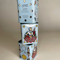 This leaning tower of Bite Society Lavender Earl Grey Tea Tins shows three sides of this tattoo themed tea tin.