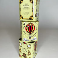 A stack of Bite Society Irish Breakfast Tea tins