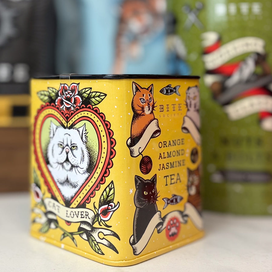 Orange Almond Jasmine Tea in cat theme tin