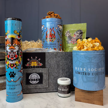 A Little Bit Salty Gift Basket with cookie and snack tins, salt, and candy bag