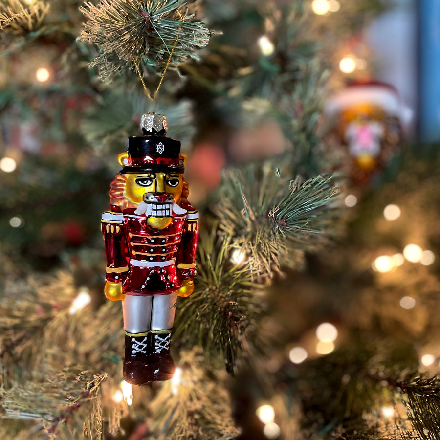 Glass Nutcracker Ornament on a tree