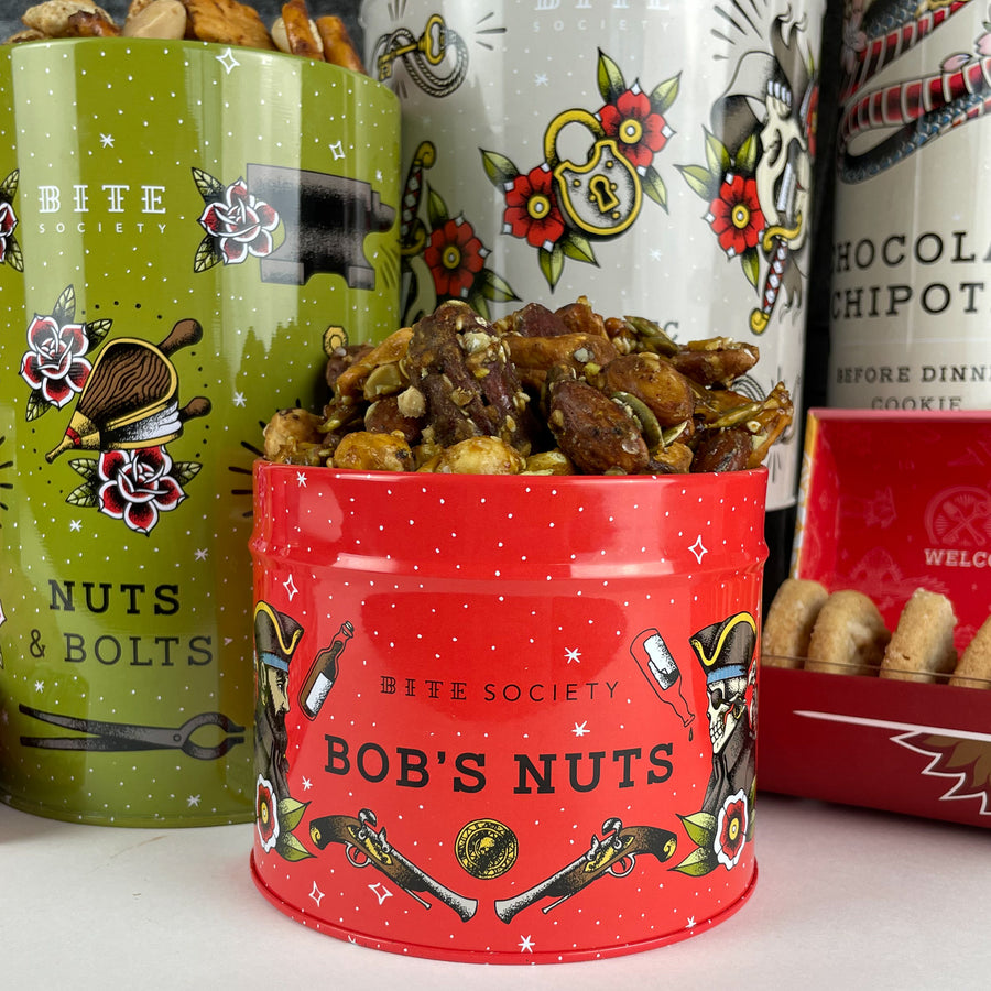 Bob's Nuts Original Spicy in front of other tins found in the Gift Basket